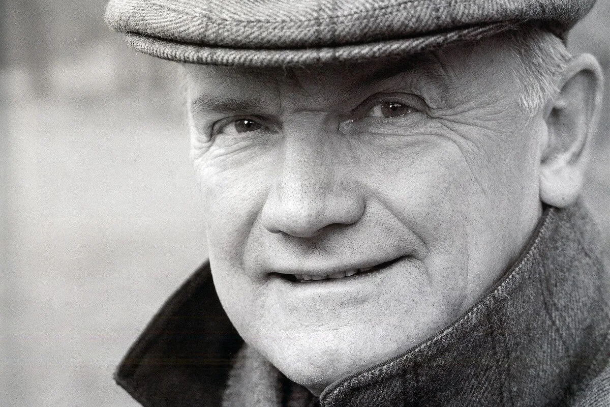 Black and white portrait of Ferdinand Karl Piech wearing a flat cap and coat