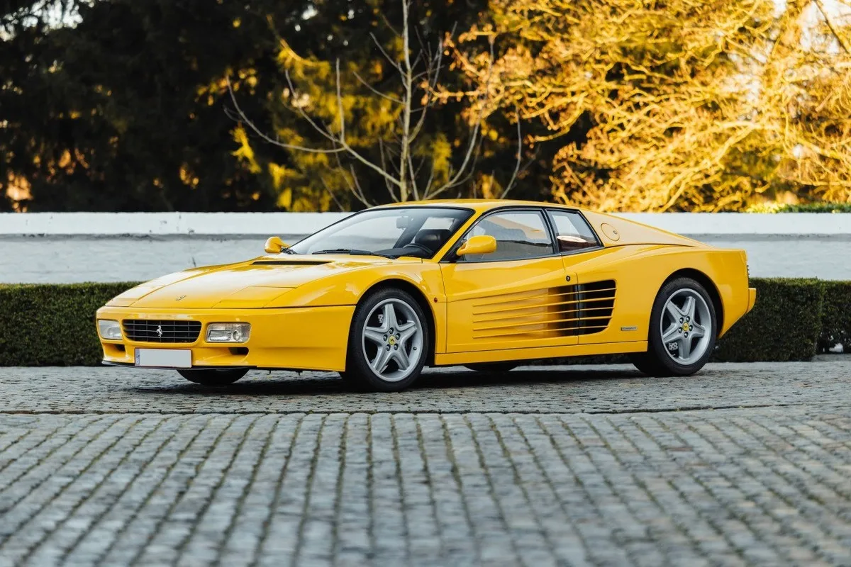 Yellow Ferrari 512 TR side view with Testarossa-style side strakes