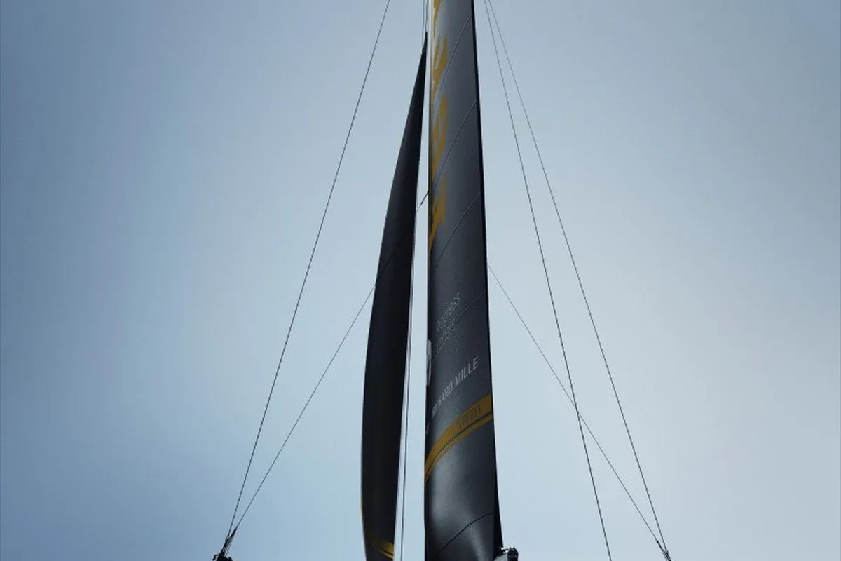 Front view render of the Ferrari Hypersail foiling sailing yacht with black sails and hydrofoils