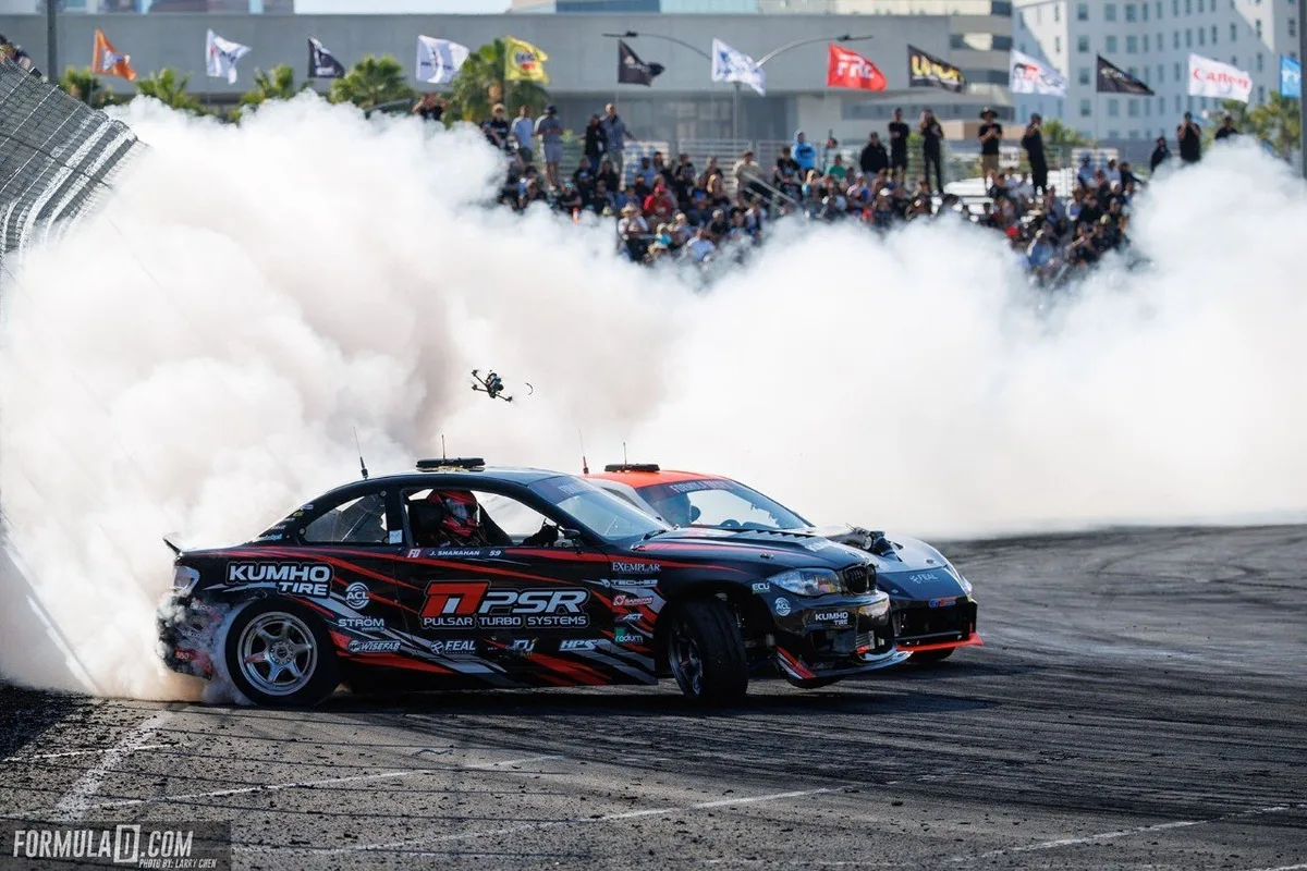 Tandem drifting through smoke at Formula Drift Long Beach Round 1 2026