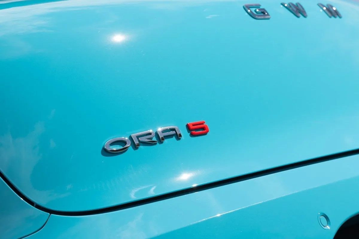 2026 GWM ORA 5 rear badge detail on turquoise paint with GWM lettering on the boot lid