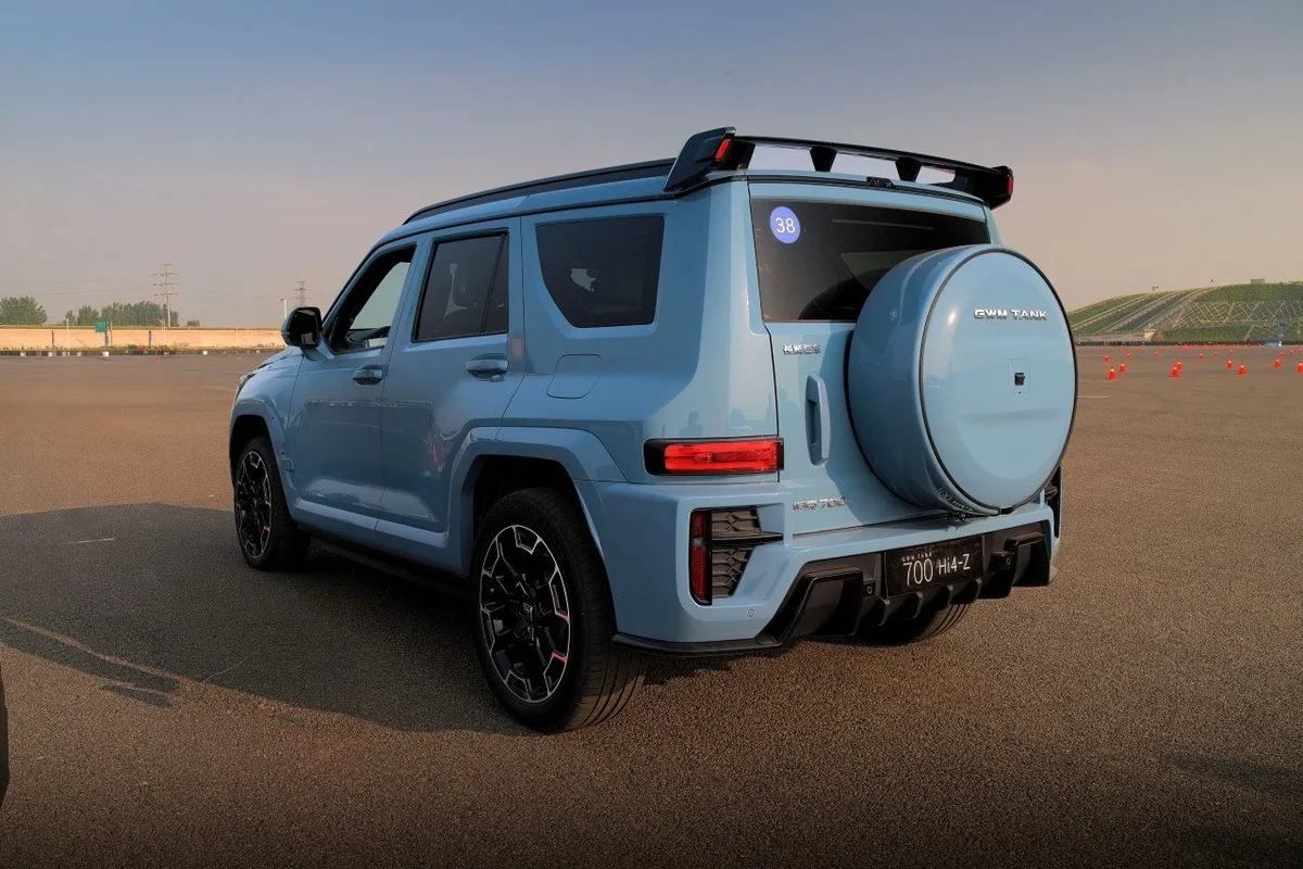GWM Tank 700 Hi4-Z light blue SUV rear three-quarter view with spare wheel cover