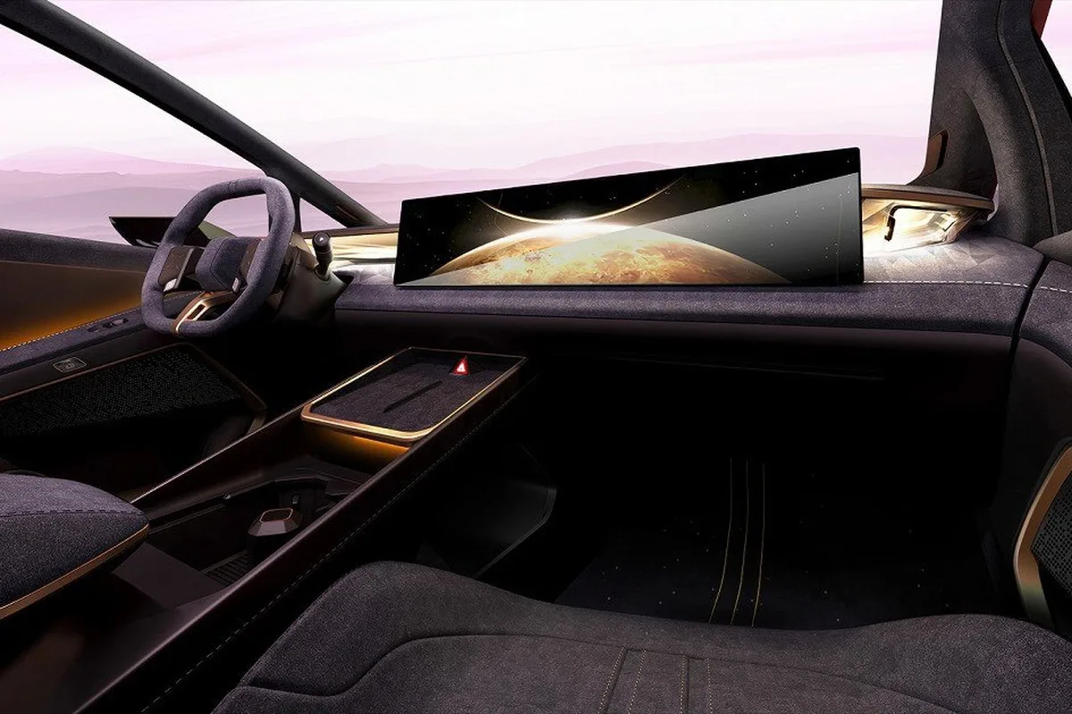 Passenger side interior view of the Hyundai VENUS concept with panoramic screen dark trim and bronze accents