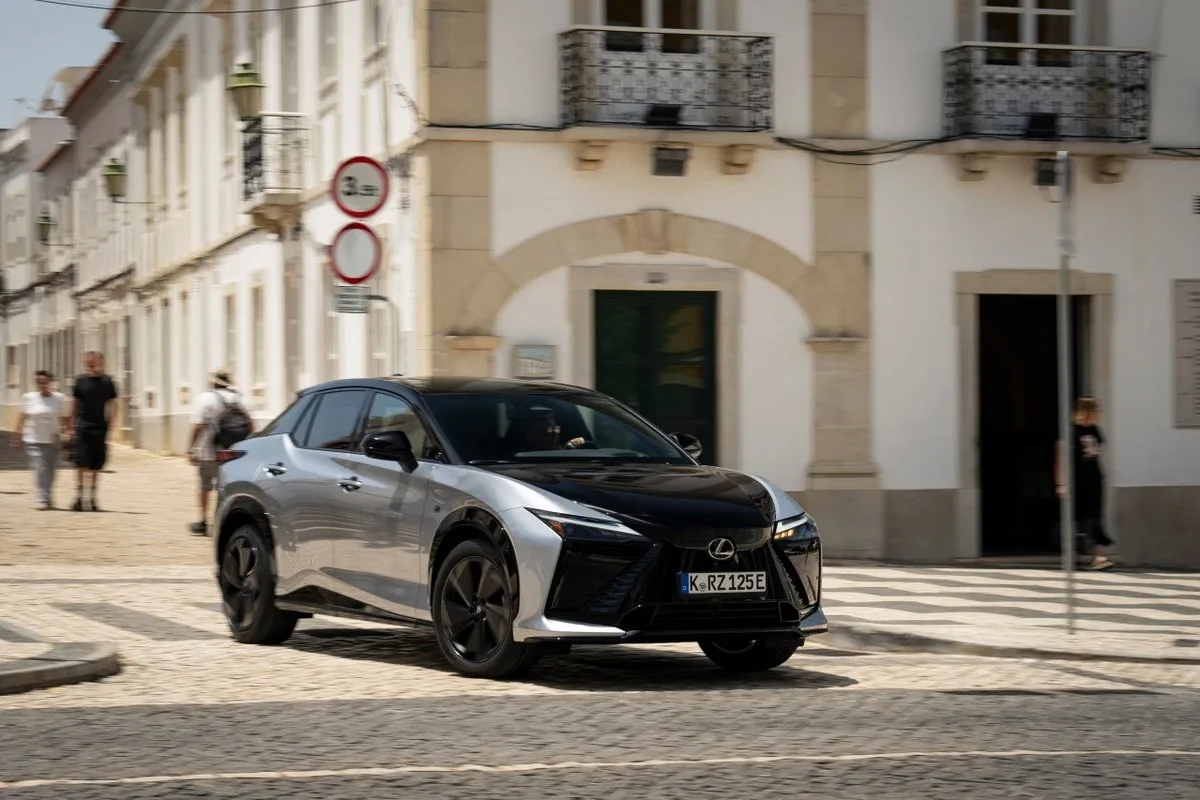 2026 Lexus RZ electric SUV front three quarter view in courtyard