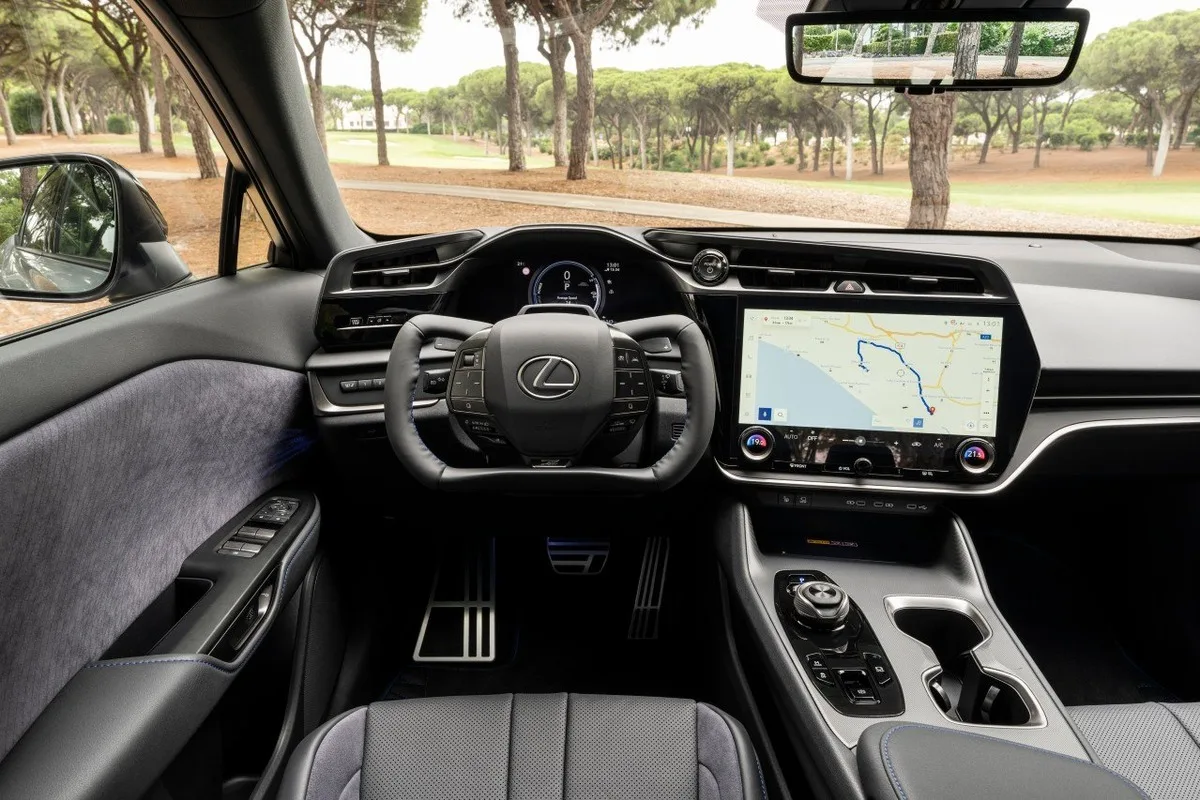 Interior of the 2026 Lexus RZ showing steer by wire yoke and central touchscreen