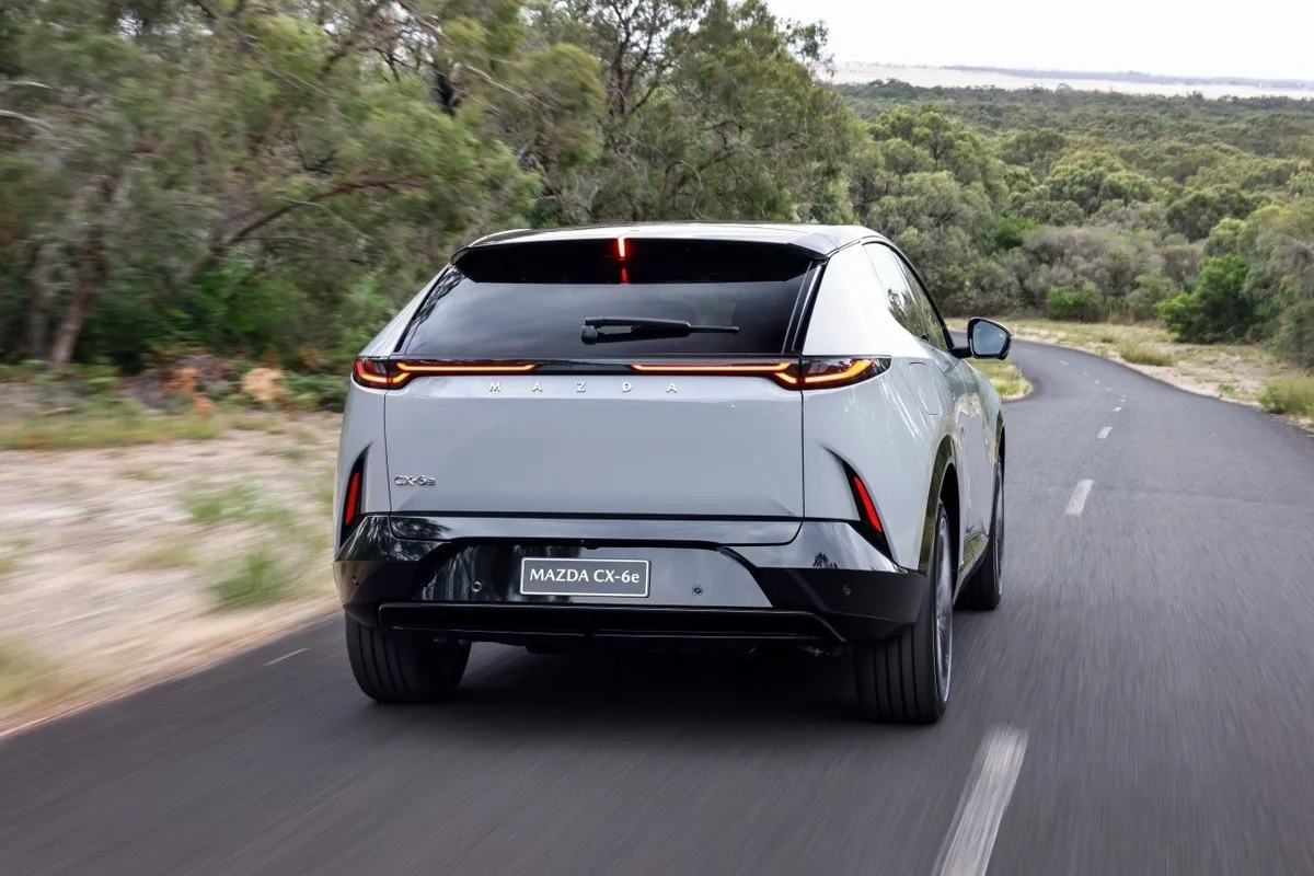 Mazda CX-6e exterior press image showing the vehicle from a promotional angle