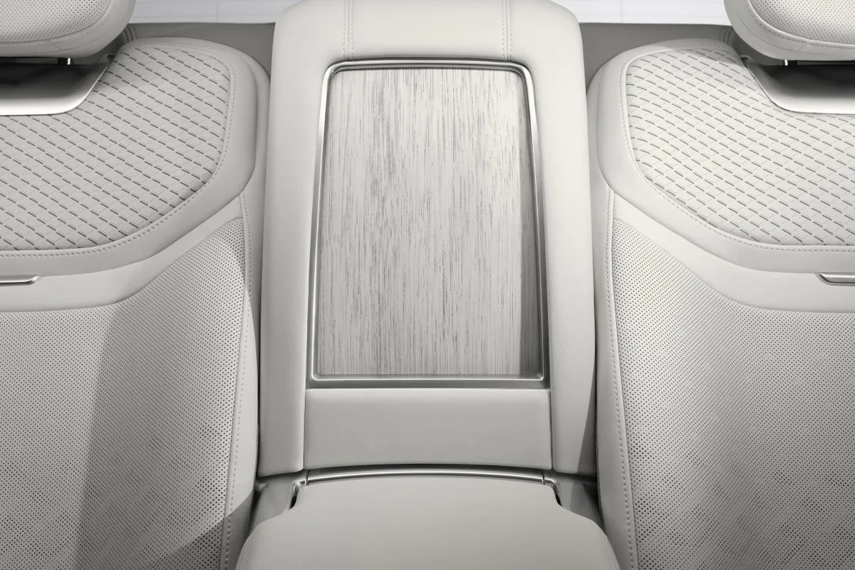 Range Rover SV Ultra rear seat upholstery detail with quilting, perforation, and pale veneer