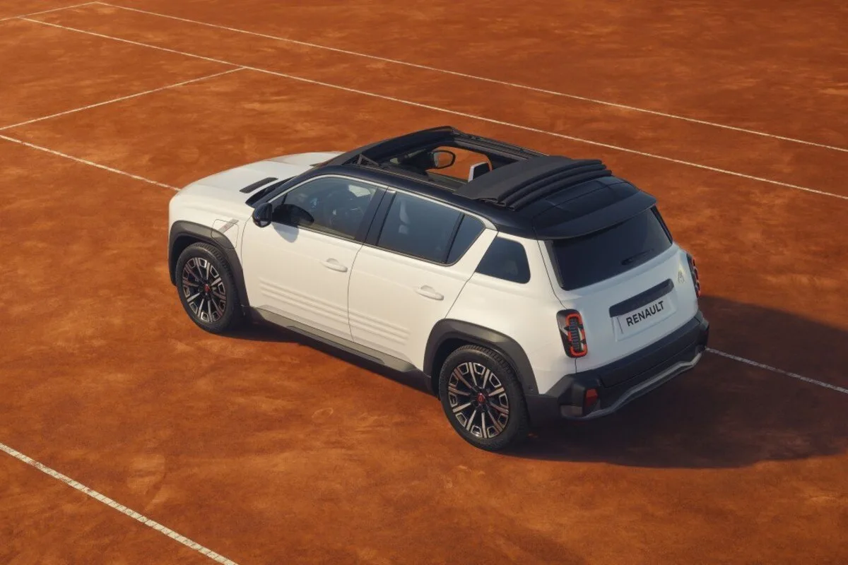 White Renault 4 Roland Garros show car with opening canvas roof on a clay tennis court