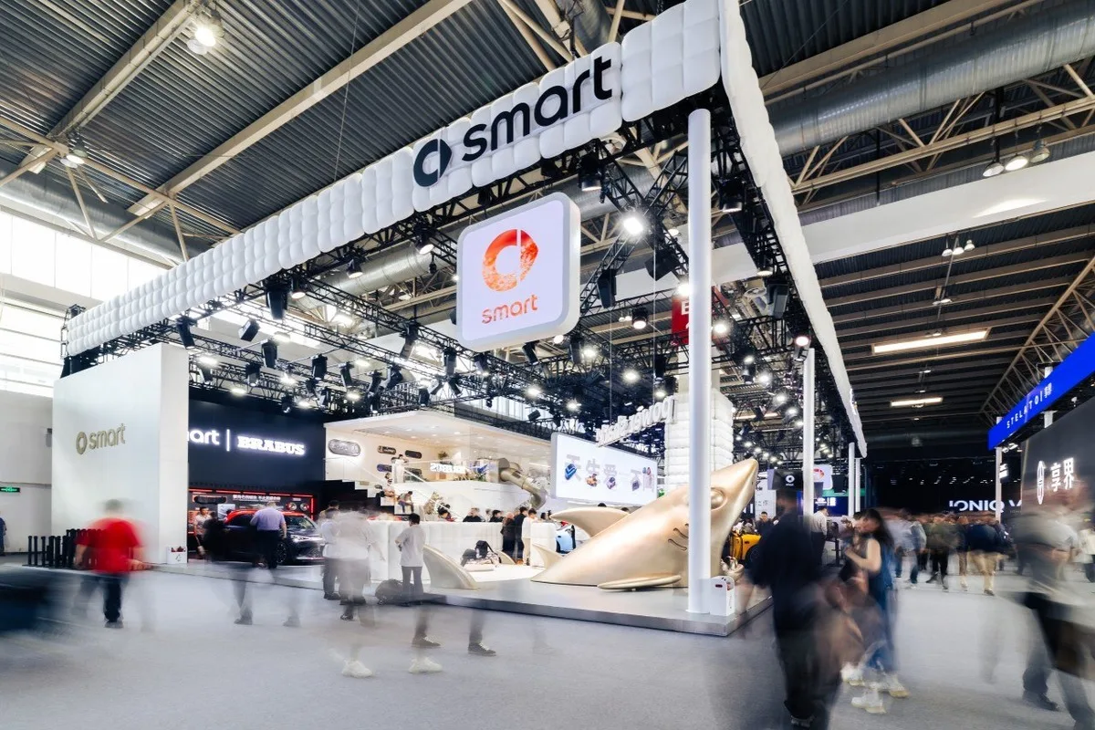 smart Auto Beijing 2026 exhibition booth with overhead smart branding and busy show floor