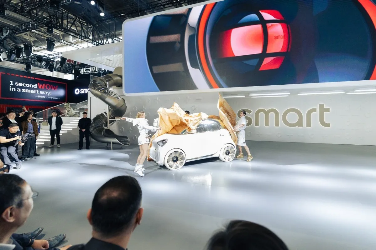 smart Concept #2 white city car being unveiled under gold fabric at Auto Beijing 2026
