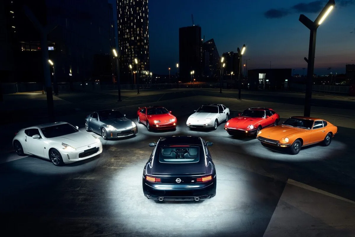 All seven generations of Nissan Z lined up at night in Melbourne