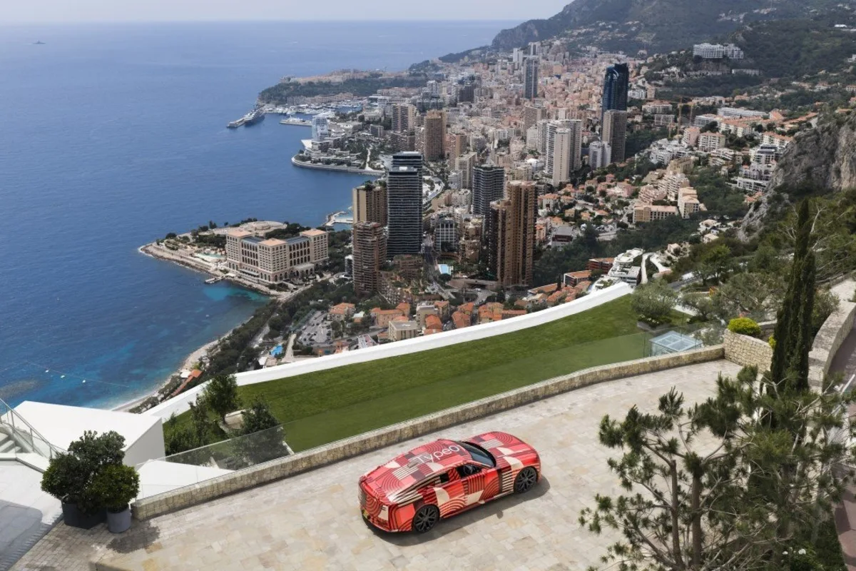 Jaguar Type 01 prototype parked above Monaco with the harbour and Mediterranean behind