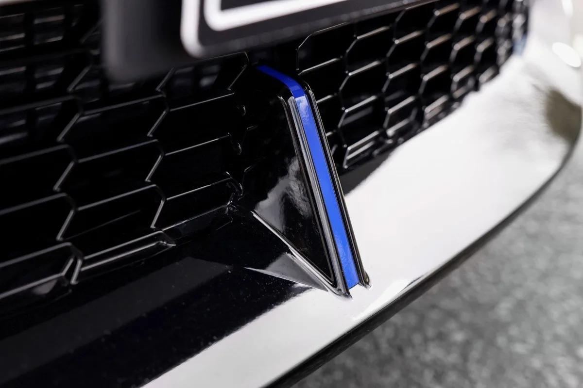 Close-up of Honda Prelude front grille trim and blue accent