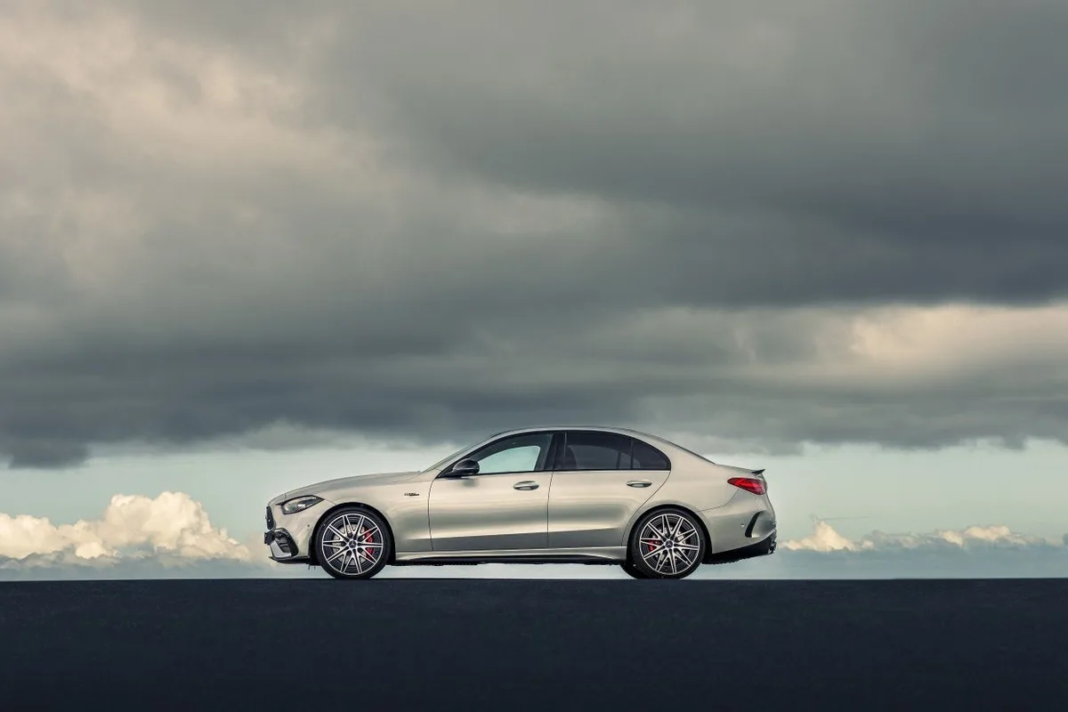 Mercedes-AMG C 43 Edition R+ silver sedan side profile under a moody sky