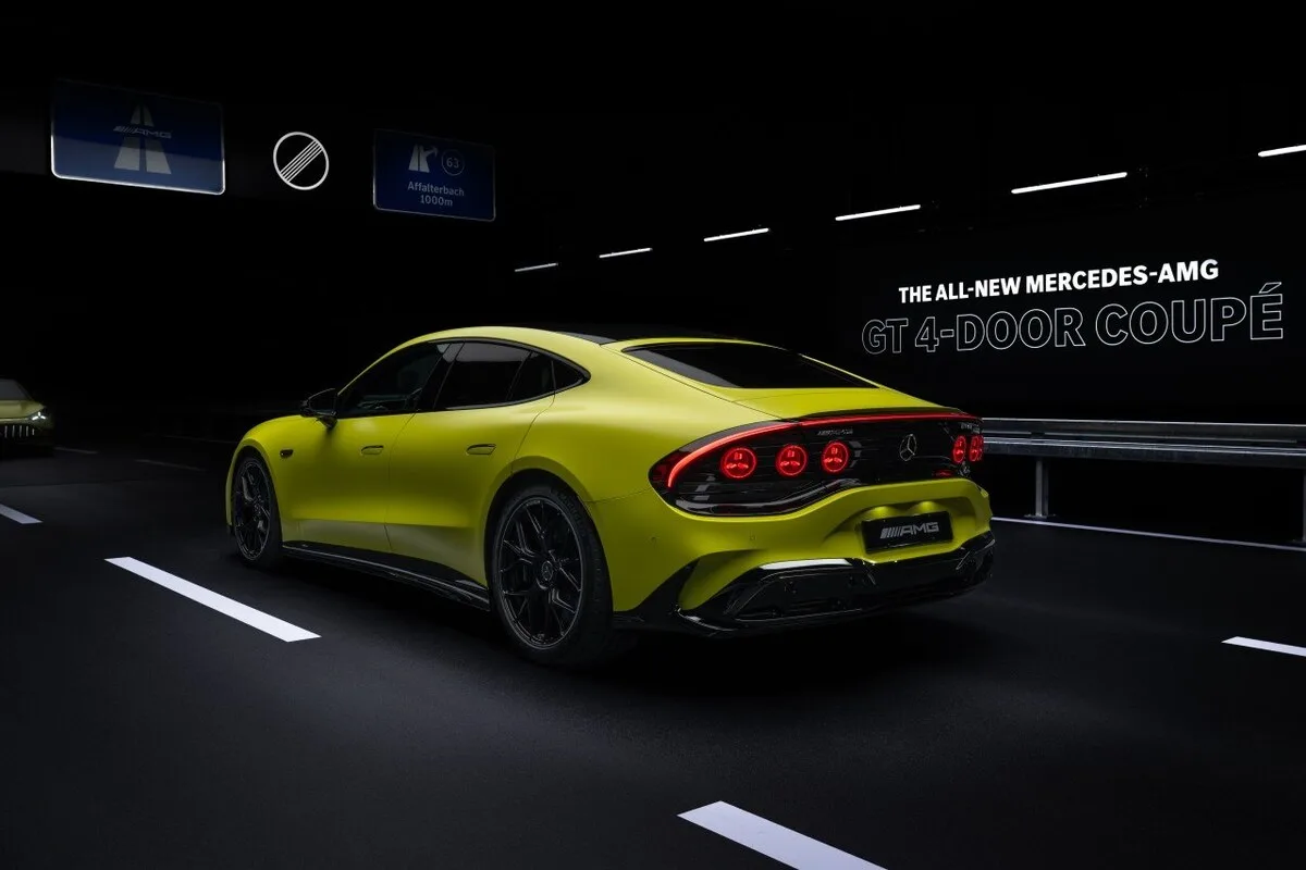 2026 Mercedes-AMG GT 4-Door Coupe EV rear three-quarter view in high-visibility yellow