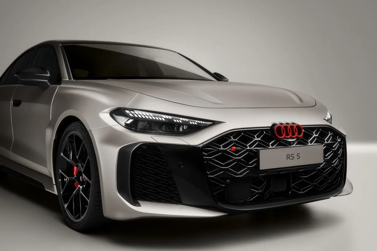 Audi RS 5 front three-quarter view with red Audi rings and RS badging