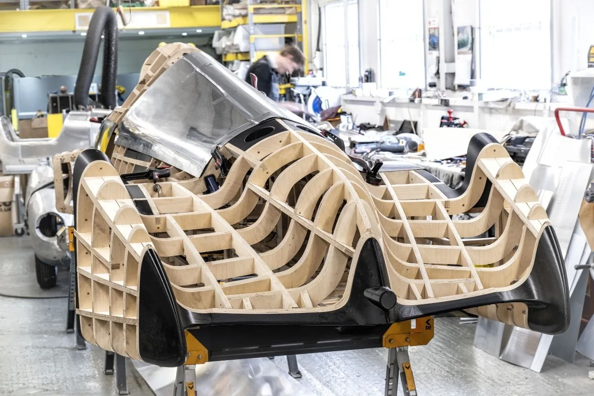Wooden body buck and metal panels during Auto Union Type 52 construction.
