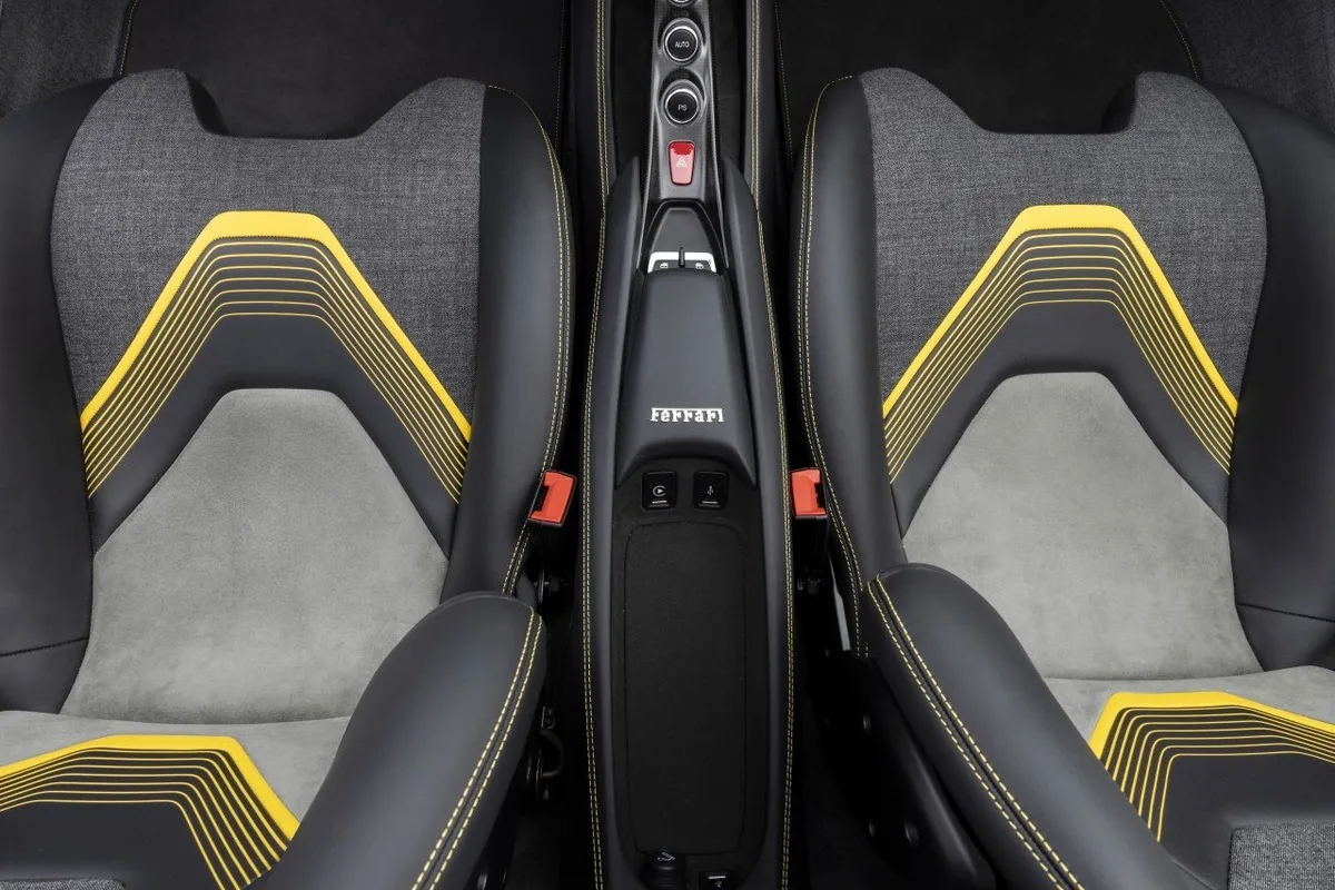 Ferrari HC25 One-Off cabin seat detail with grey trim and yellow graphic accents.