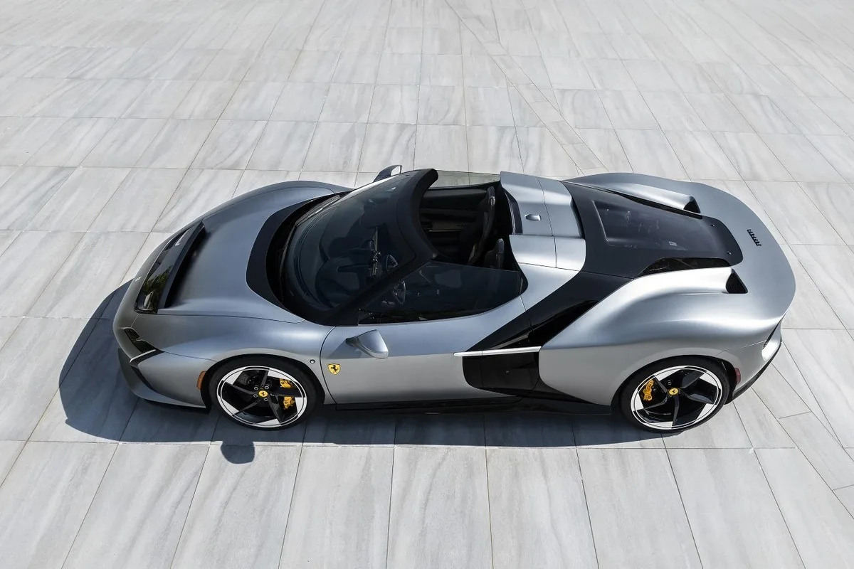 Ferrari HC25 One-Off open-top roadster viewed from above, showing black aerodynamic accents and yellow brake calipers.