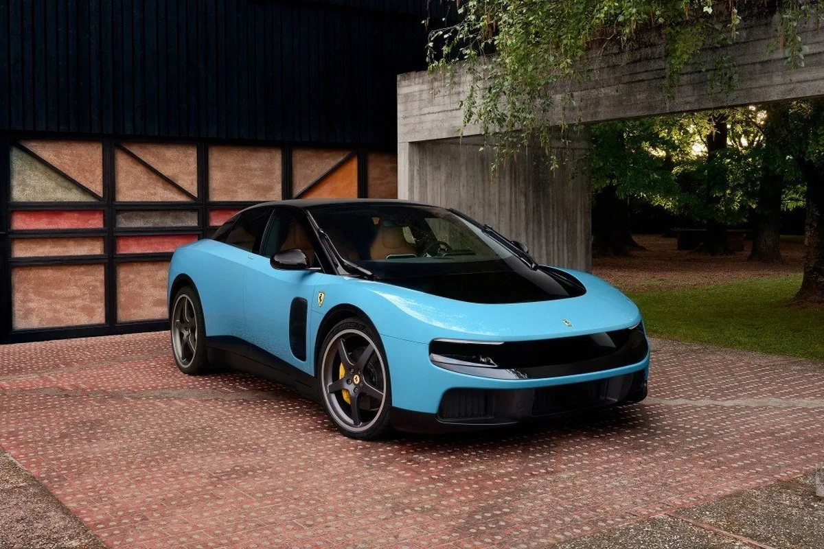 Ferrari Luce front three-quarter view in pale blue outside a modernist villa