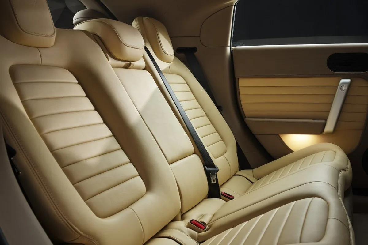 Ferrari Luce beige rear seats with door trim and panoramic roof detail