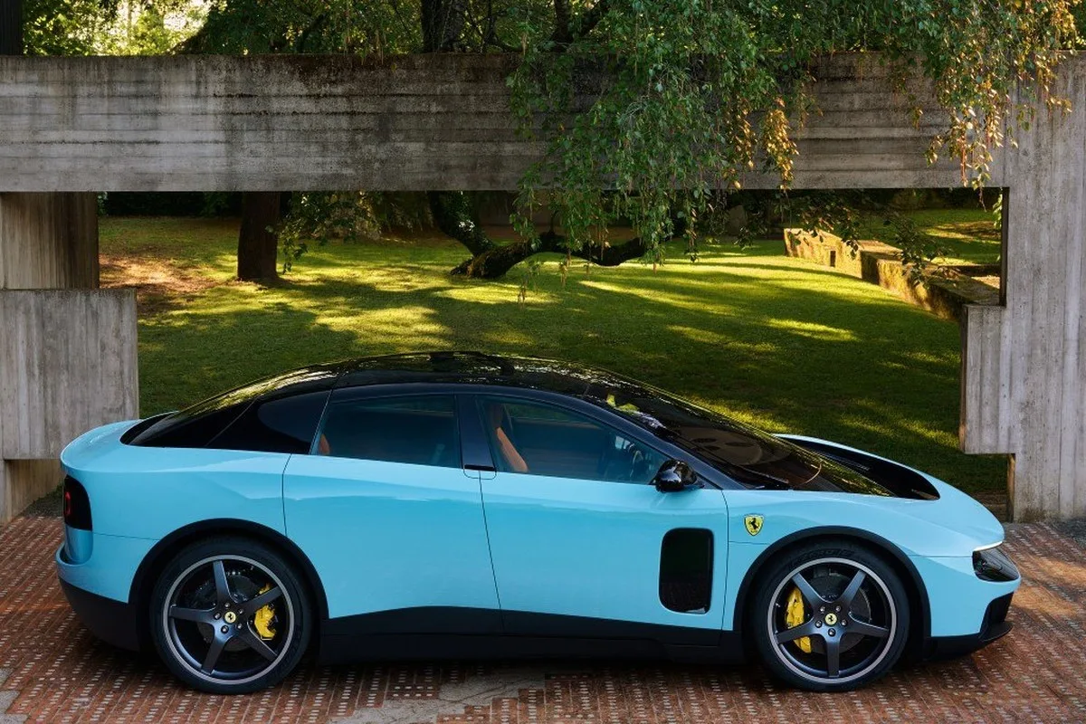 Ferrari Luce side profile in pale blue showing long roofline and four-door body