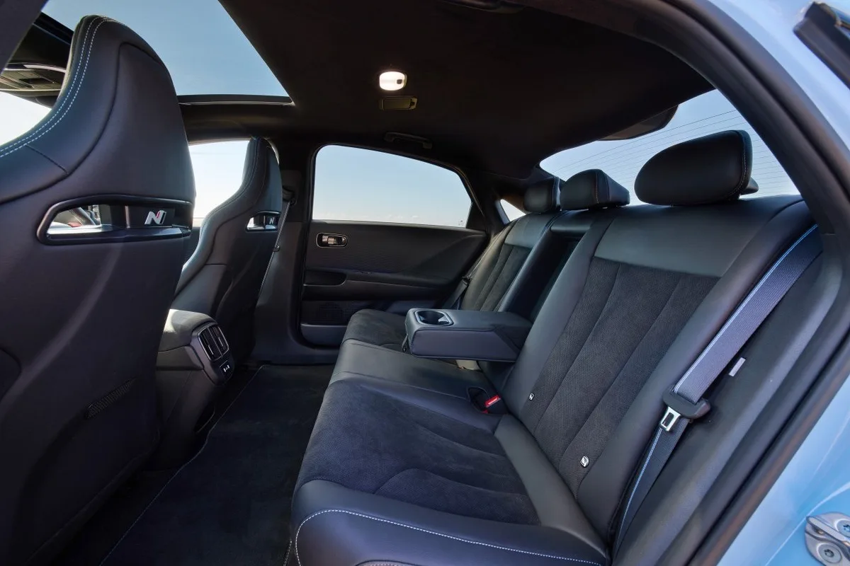 Rear seat of the Hyundai IONIQ 6 N with black sports trim and centre armrest