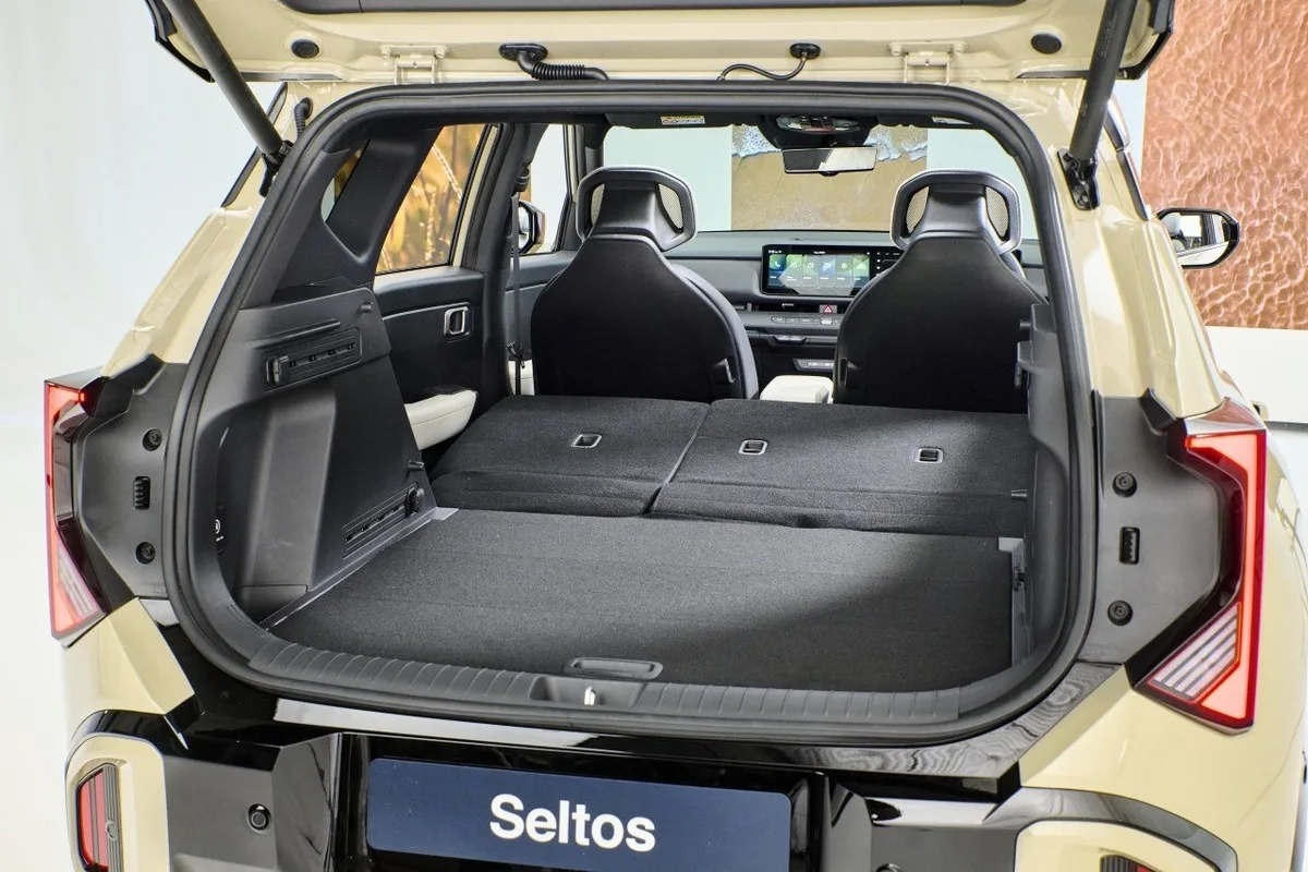 All-new Kia Seltos with tailgate open and rear seats folded flat