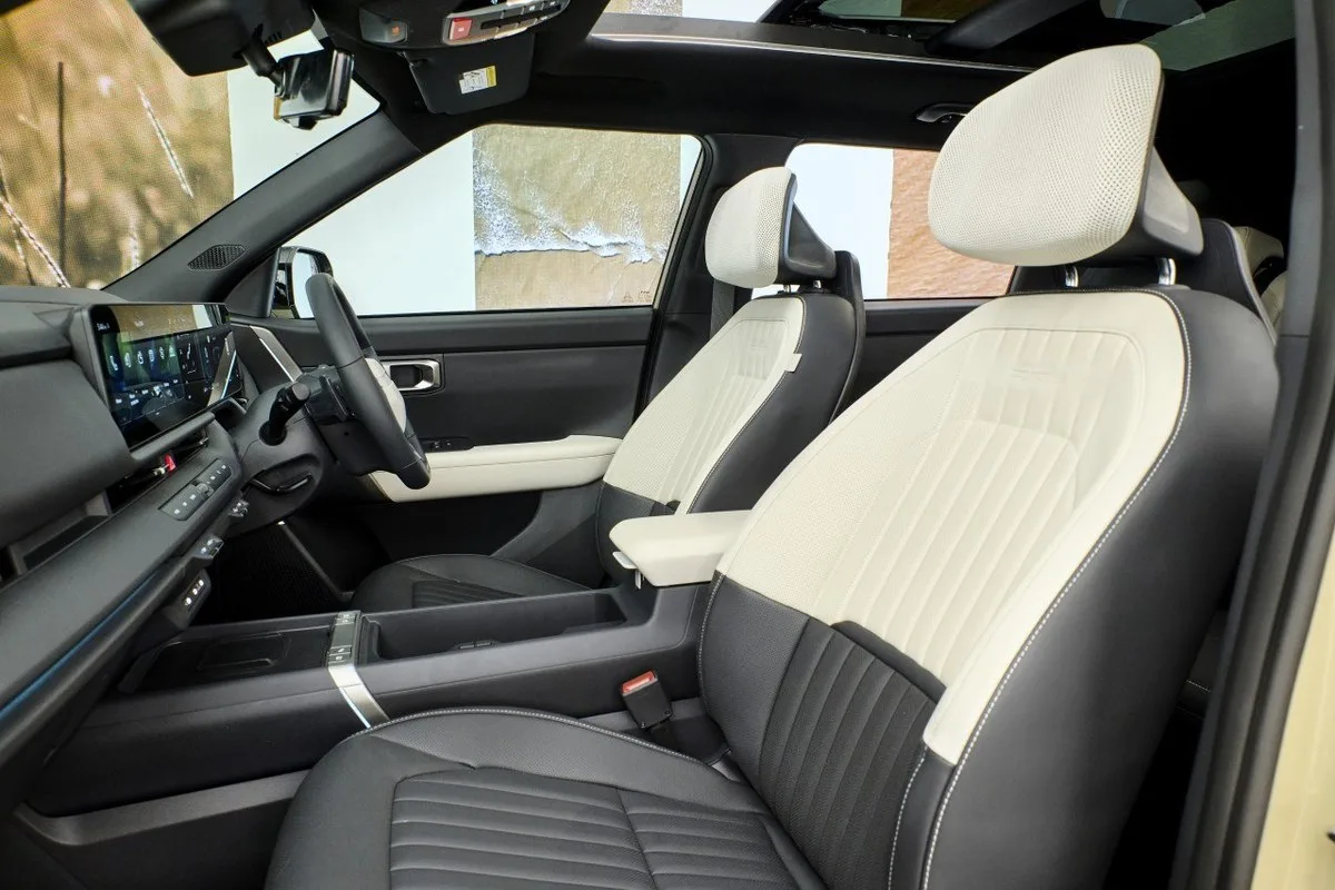 All-new Kia Seltos front seats with black and cream upholstery and panoramic roof