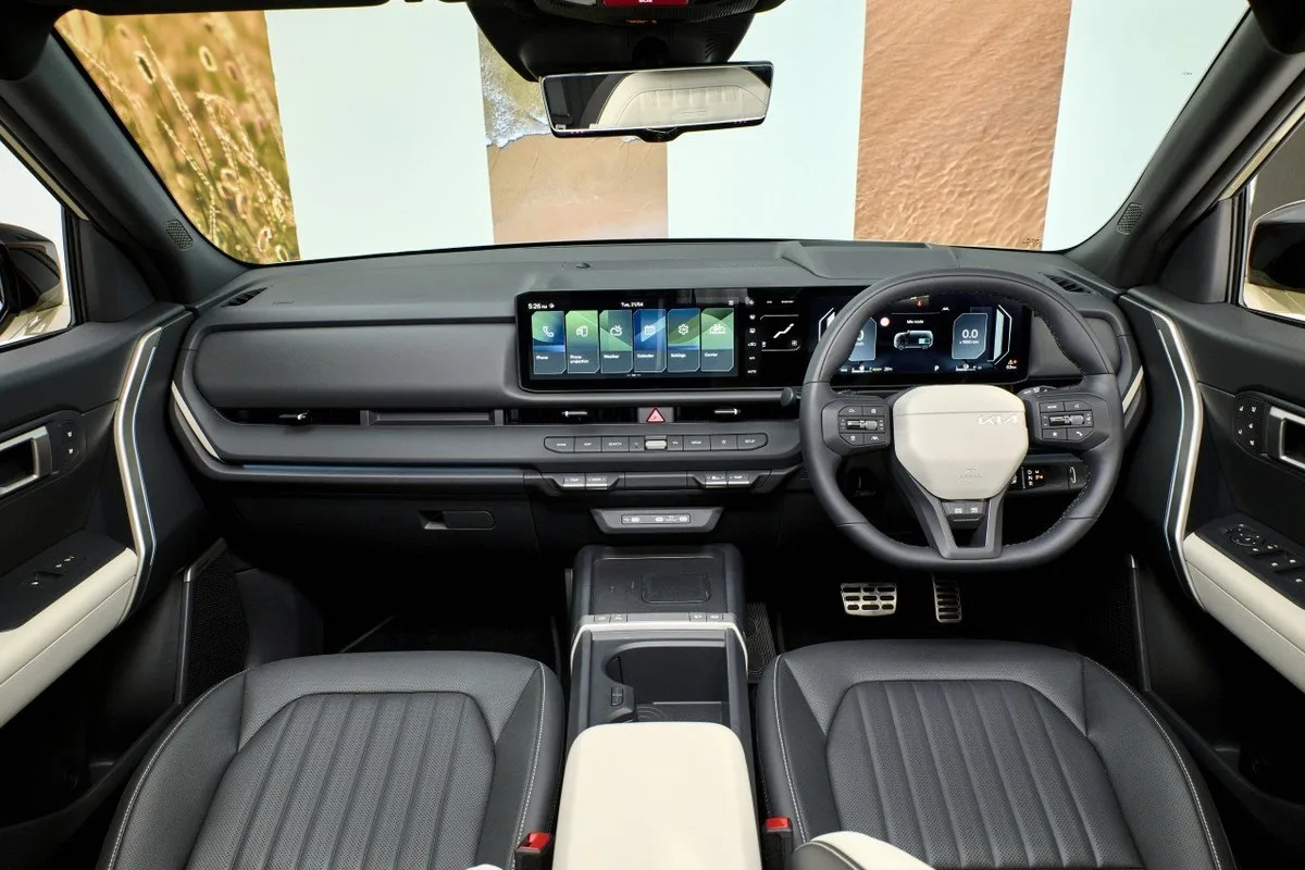 All-new Kia Seltos dashboard and right-hand-drive interior seen from the rear seat