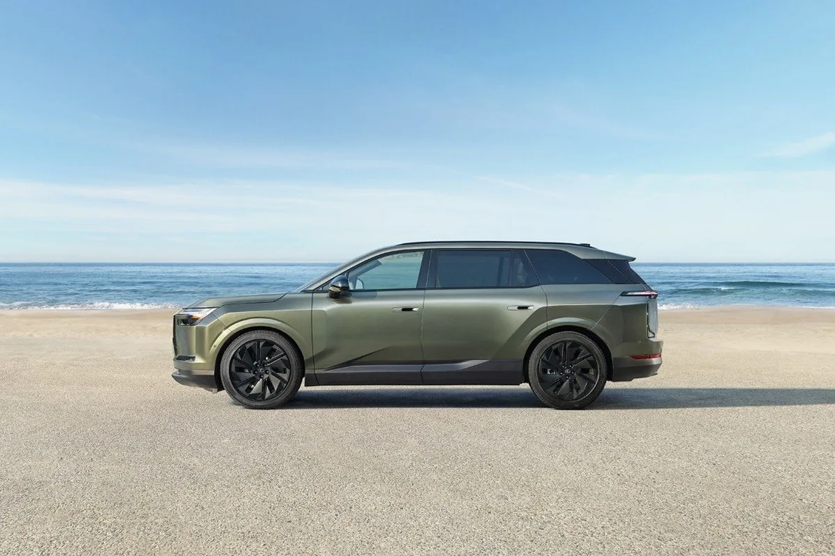 Lexus TZ electric SUV side profile near the beach.
