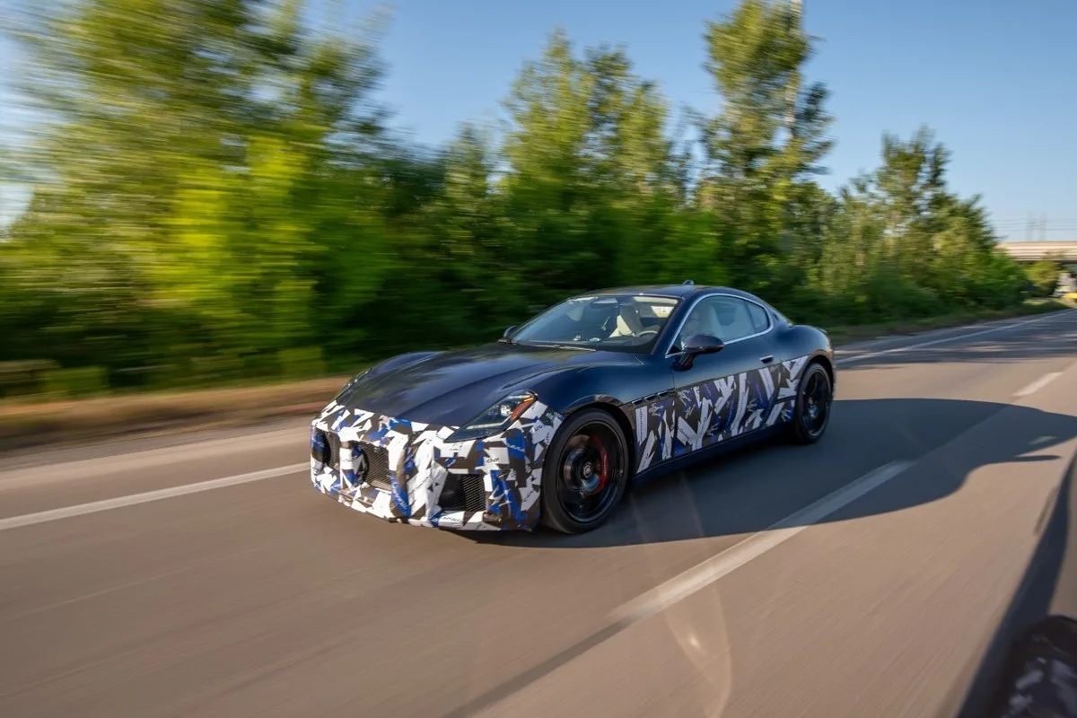 Camouflaged Maserati GranTurismo test car driving near Modena