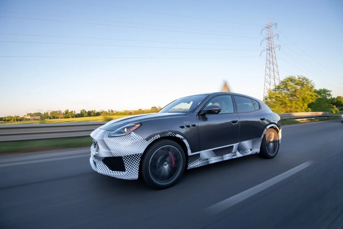 Camouflaged Maserati Grecale SUV prototype on the road near Modena