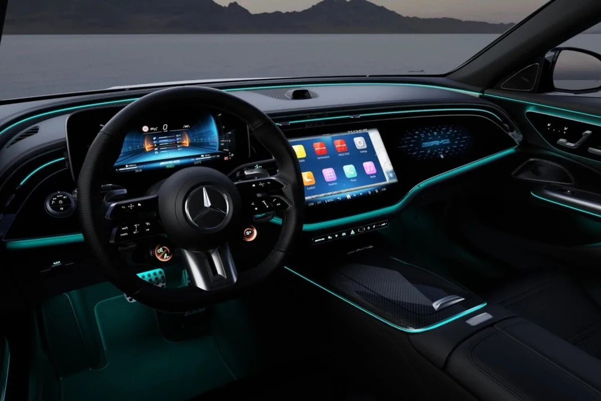 Mercedes-AMG E 53 HYBRID Dark Carbon Edition interior with ambient lighting and AMG steering wheel.