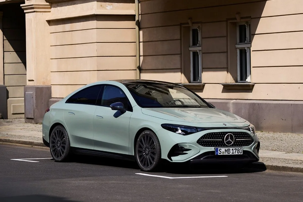 All-new Mercedes-Benz CLA front three-quarter view parked outside a stone building.