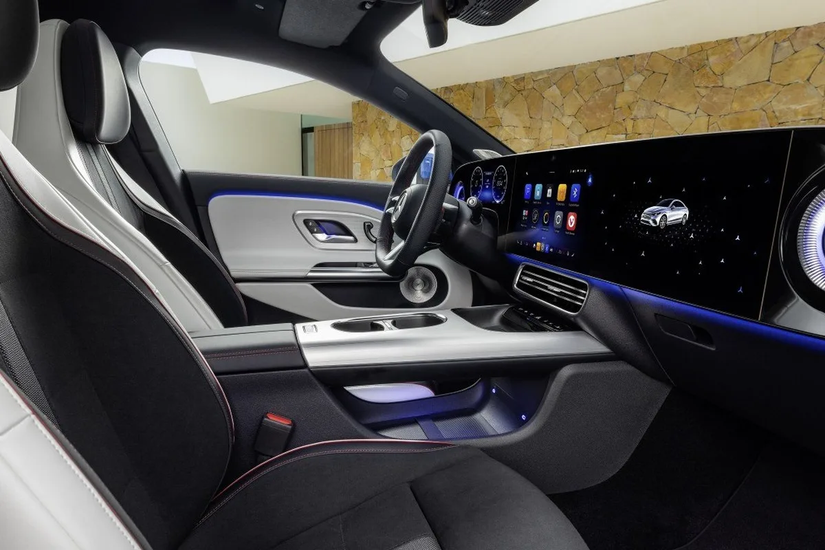 Mercedes-Benz CLA cabin with MBUX Superscreen, sports seats and ambient lighting.