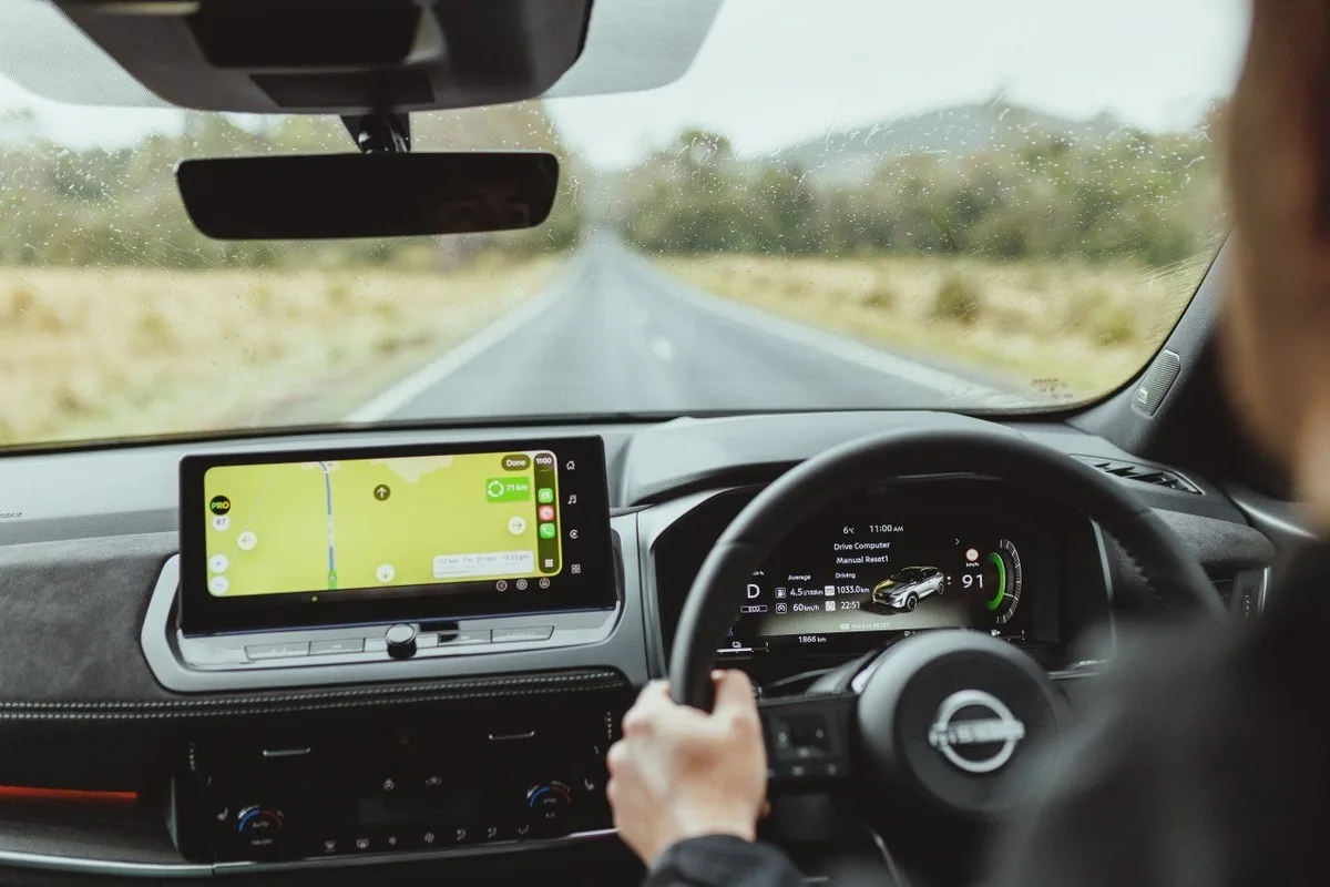 Nissan Qashqai e-POWER navigation screen with a Tasmanian road ahead.