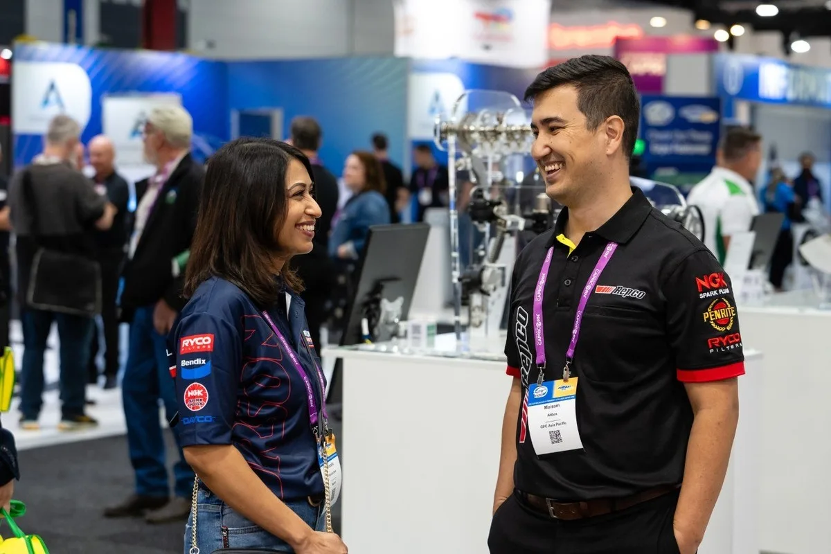 Repco staff talking at the Australian Automotive Aftermarket Expo booth