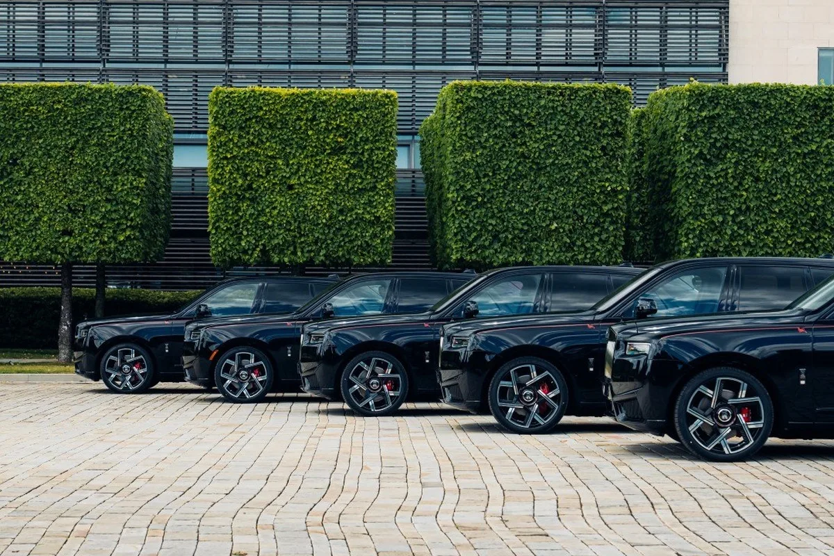 Five black Rolls-Royce Black Badge Cullinan by Cyril Kongo commissions parked in a formal lineup.