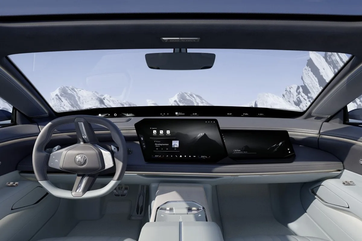 Vision BMW ALPINA dashboard with panoramic display and mountain view.