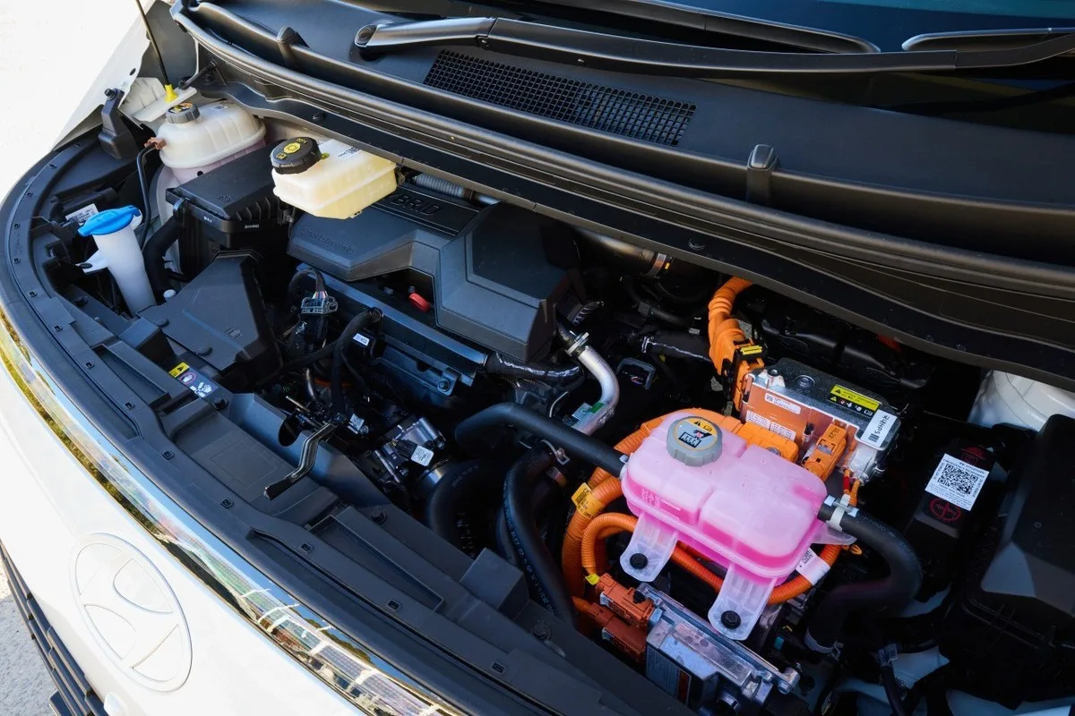 2027 Hyundai Staria hybrid engine bay showing orange high-voltage components
