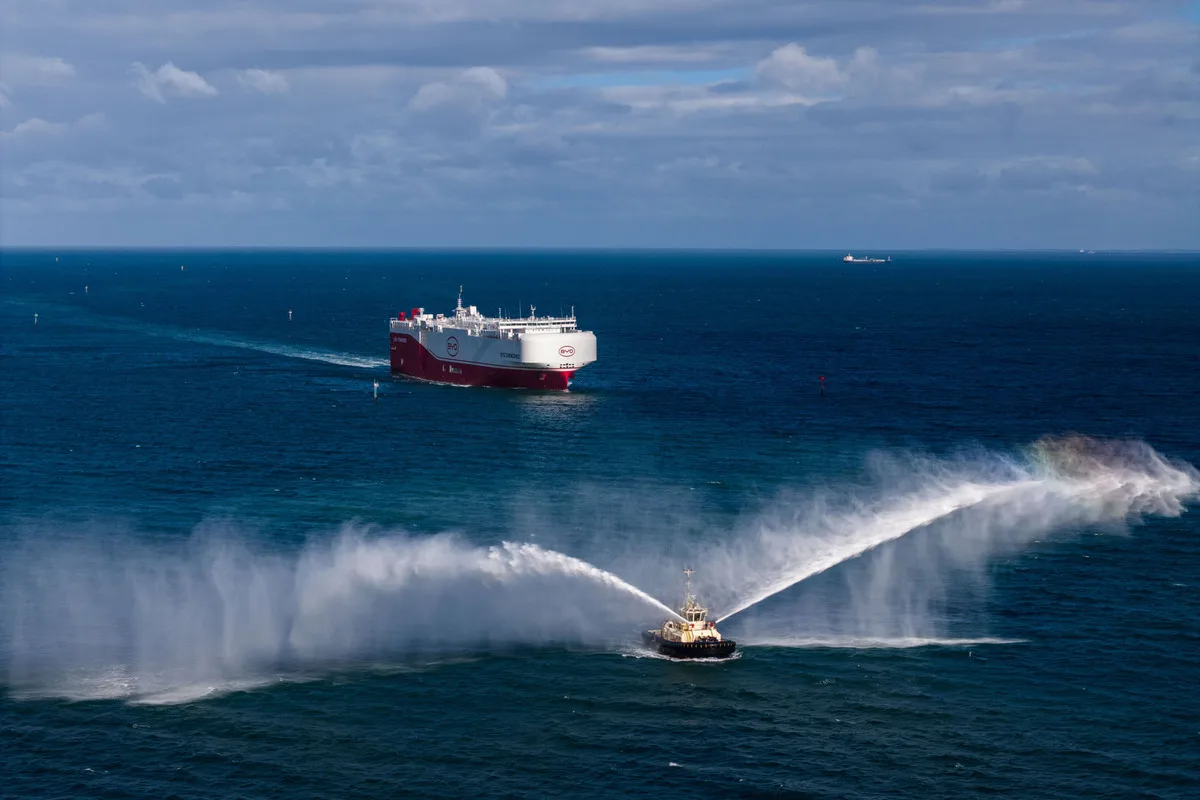 BYD Zhengzhou vehicle carrier offshore near Melbourne with a boat crossing in front