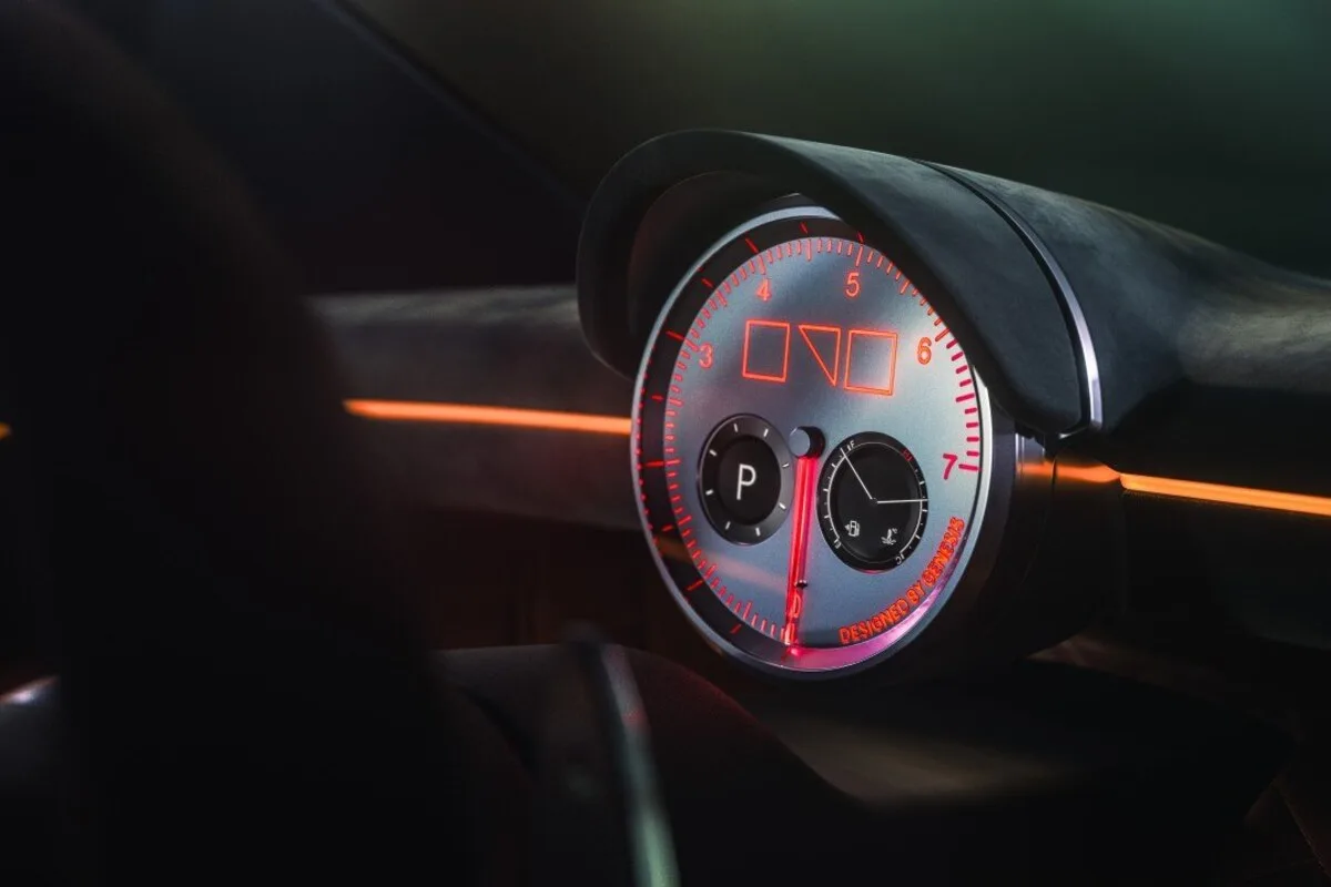 Close-up of the Genesis Magma GT Concept circular gauge with orange graphics