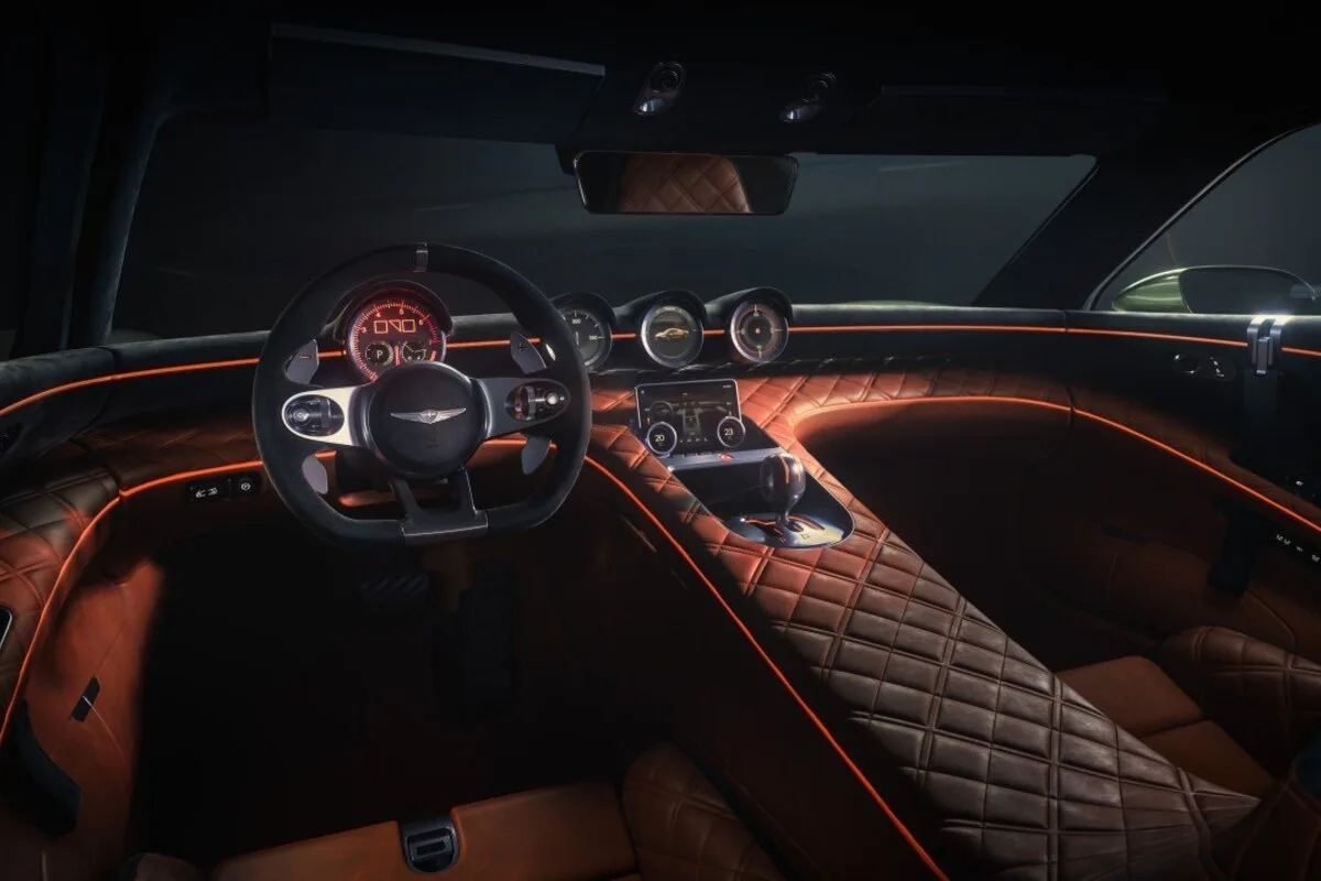 Genesis Magma GT Concept interior with quilted brown trim and orange ambient lighting