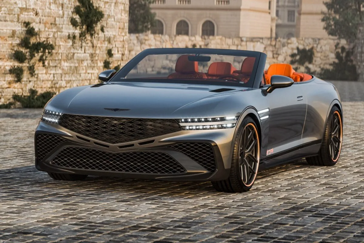 Genesis X Gran Convertible Concept on a cobbled street with its roof open