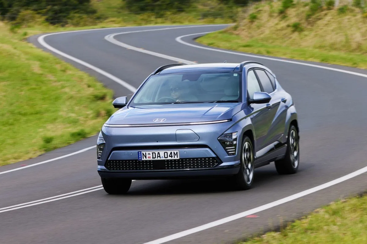 Hyundai Kona Electric driving on a winding country road