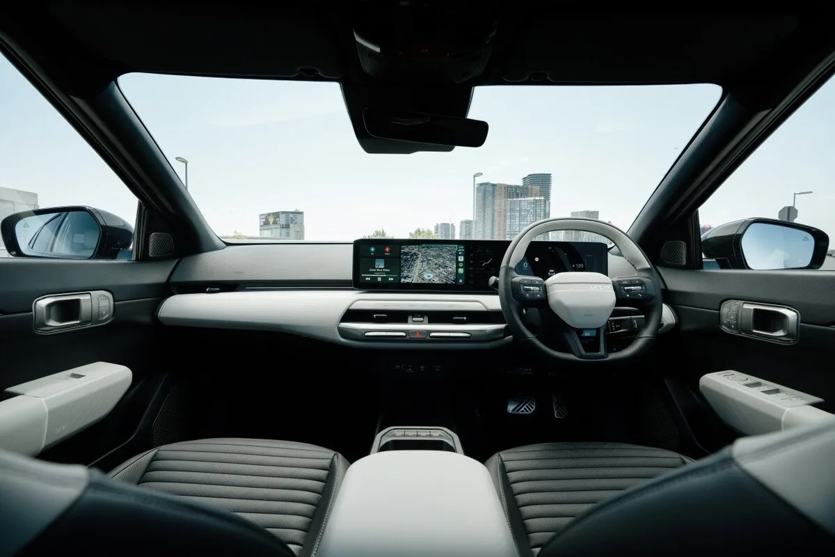 2026 Kia EV4 Earth Long Range dashboard with wide digital display and right-hand-drive layout