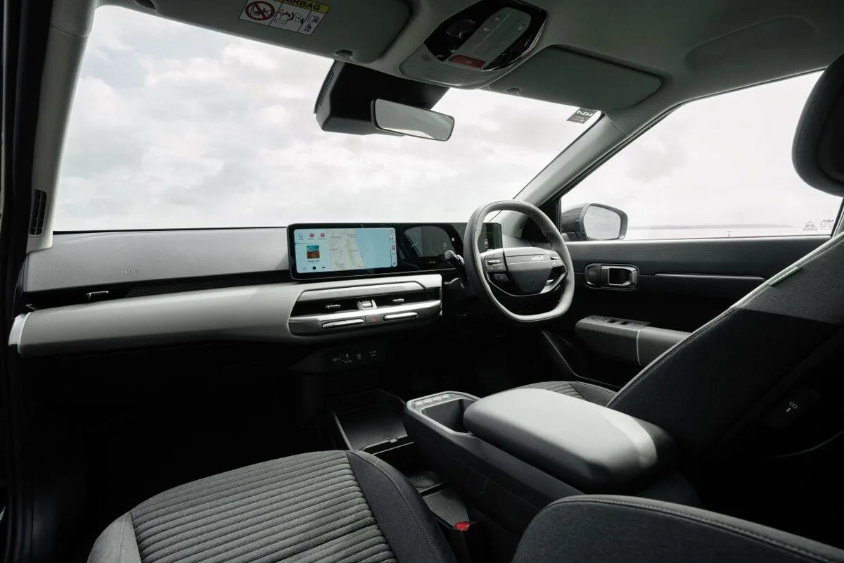 2026 Kia EV4 Earth Long Range front cabin showing the dashboard, steering wheel, and centre console