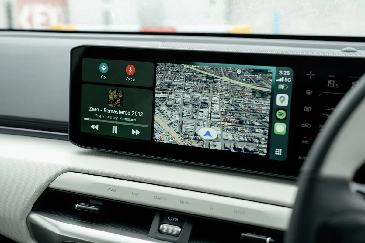 2026 Kia EV4 Earth Long Range infotainment screen showing Apple CarPlay navigation and music