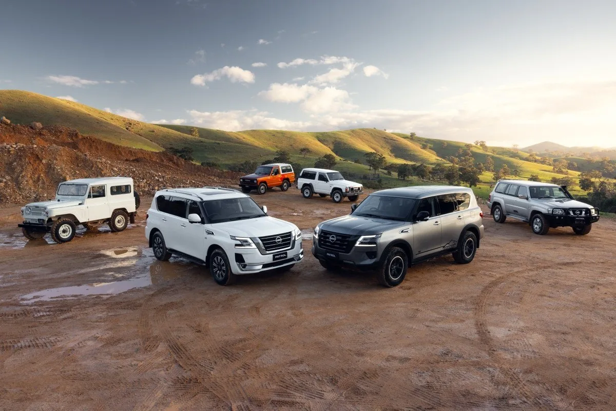 Nissan Patrol Y62 and Patrol Warrior models shown together in a heritage lineup.